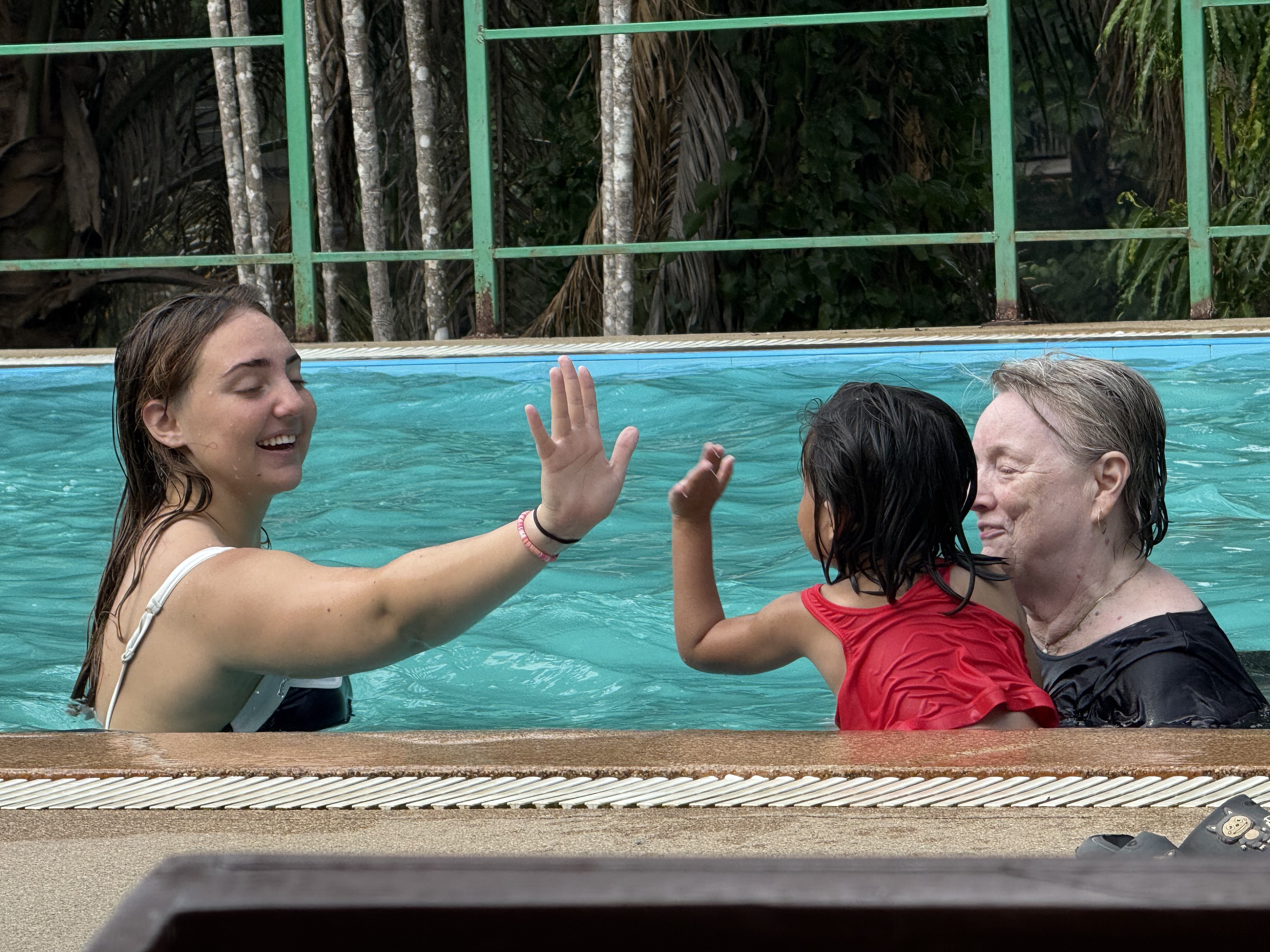 The Faith House girls and team enjoying swim time at the resort